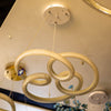 Golden Infinity Loop LED Chandelier – Modern Glow